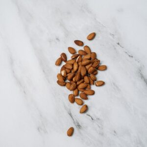 Almonds On White Surface